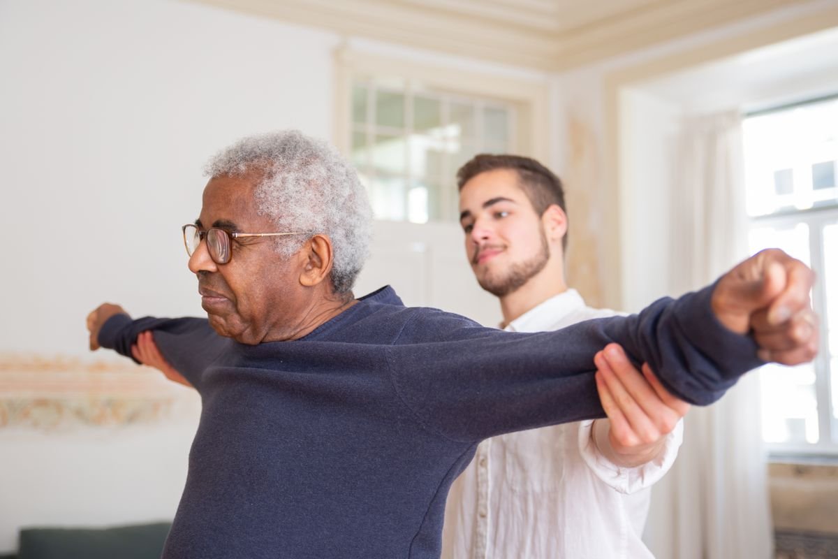 Senior receiving stroke rehabilitation physiotherapy at home in Kochi